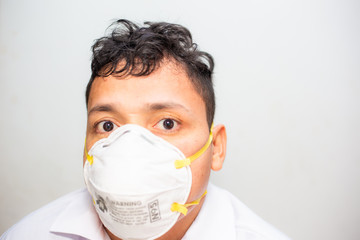 Asian man wearing N95 mank protect from Covid19 and Pm2.5 on white background