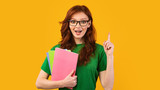Fototapeta  - Geek Student Girl Having Idea Standing On Yellow Background, Panorama