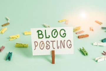 Text sign showing Blog Posting. Business photo showcasing regular record of someone s is thoughts opinions or experiences Colored clothespin rectangle square shaped paper light blue background