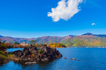 Wall Mural - Japan. Kawaguchiko Lake. Journey through the five lakes of Fuji. Volcanic stones off the coast. Kawaguchiko lake in sunny weather. Vacations in Fyuzhikavaguchiko. Nature of Yagizaki Park. Landscape