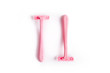 Pink razor isolated on a white background
