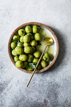 Green Olives In A Ceramic Bowl