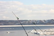 © albert - fishing gear on a blurred background of a spring river with floating ice floes
