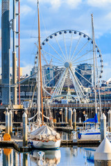 Wall Mural - Seattle waterfront and marina with the Ferris wheel on a bright sunny day with clouds