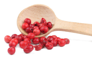 Wall Mural - Red pepper peas in the wooden spoon isolated on white