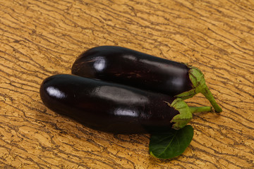 Ripe tasty Eggplant over wooden background