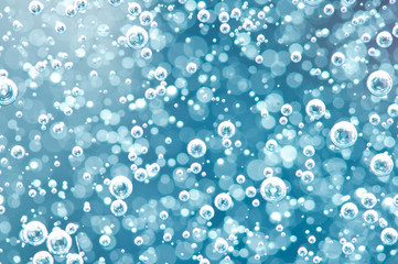macro oxygen bubbles in water on blured background, concept such as ecology