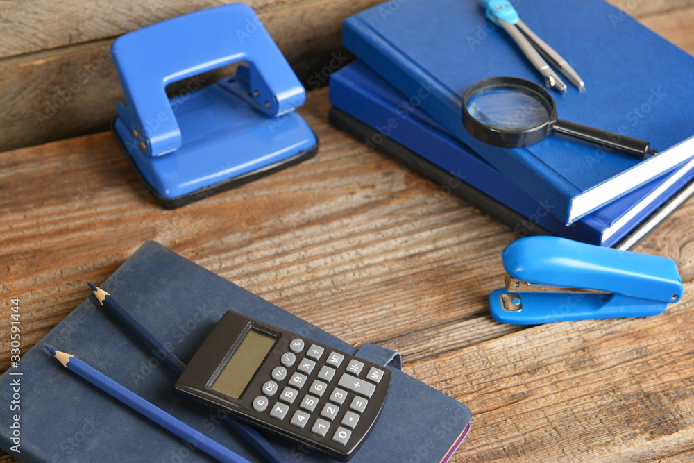 Set of school supplies on wooden table