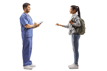 Wall Mural - Female student taking to a doctor in a blue uniform