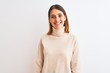 © Krakenimages.com - Beautiful redhead woman wearing winter turtleneck sweater over isolated background with a happy and cool smile on face. Lucky person.