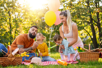 Canvas Print - Happy family in the park together on a sunny day