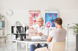 © Pixel-Shot - Young man visiting urologist in clinic