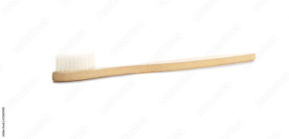 Wooden tooth brush on white background