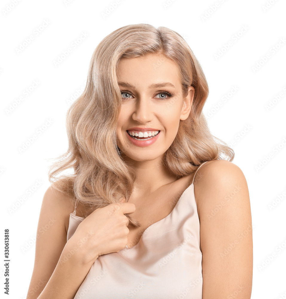 Young blonde with beautiful hair on white background