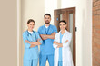 © New Africa - Group of doctors walking in clinic. Medical service