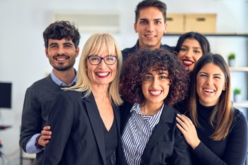 Group of business workers smiling happy and confident. Posing together with smile on face looking at the camera at the office