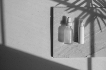 Wall Mural - cosmetic skincare packaging . beauty product mock up on luxury white marble with natural light and shadow.