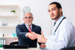 © Elnur - Male doctor and businessman discussing medical project
