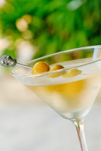 Alcohol Martini Cocktail With Green Olives And A Skull