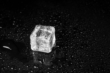 ice cubes on black table background.