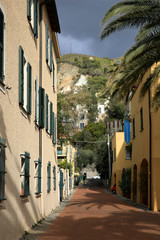 Wall Mural - Varigotti (SV), Italy - December 30, 2017: A tipycal road and houses in Varigotti village, Italian Riviera, Savona, Liguria, Italy