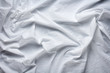 © aninna - wrinkled white cotton sheet with large folds as background