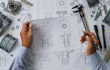 Poster - Engineer technician designing drawings mechanical parts engineering Engine.manufacturing factory Industry Industrial work project blueprints measuring bearings caliper tools