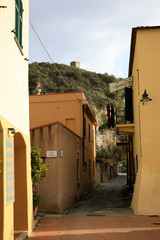 Wall Mural - Varigotti (SV), Italy - December 30, 2017: A tipycal road and houses in Varigotti village, Italian Riviera, Savona, Liguria, Italy