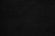 © sandipruel - Abstract black background. Black stucco texture. Dark rough surface.