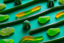 Background Of Jelly Sweets Of Different Shapes, Clouse Up Shot. Different Shades Of Green.specially For Your St.Patrick's Day Design.