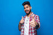 © F8  \ Suport Ukraine - Happy indian man with thumbs up gesture, isolated on blue background