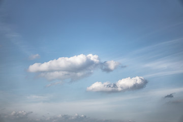 Wall Mural - beautiful sky on a blue background with an airplane window. white clouds of various shapes. stock ba