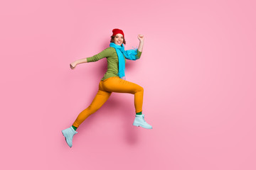 Sticker - Full length profile side photo of cheerful lucky excited girl jump run after season discounts wear red blue headwear footwear isolated over pink color background