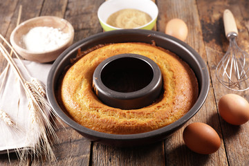 homemade cake with ingredient on wood background