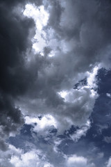Wall Mural - terrible thunderclouds from the side of a plane. gloomy epic clouds. background image in a dark gray