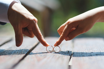 Wall Mural - couple playing with wedding rings