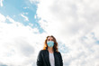 © belyaaa - Woman wearing medical mask. Stop spreading Coronavirus. Don't travel, stay at home concept image.