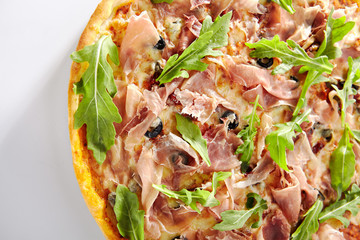 Canvas Print - Pizza with Dried Tomatoes, Capers, Prosciutto, Arugula and Mozzarella