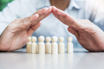 Businessman hand cover man wooden from crowd of employees. People, Business, Human resource management, Life Insurance, Teamwork and leadership Concepts