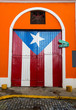 A door  that has the Puerto Rican flag painted on it in Old San Juan.