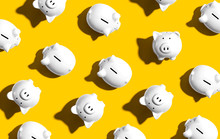 White Piggy Banks Overhead View - Flat Lay