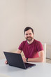 © Sergey - Men remote work from home behind laptop during epidemic in quarantine