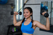 © chayathon2000 - Asian woman in fitness gym