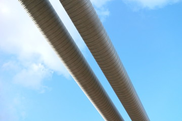 two water pipes against a blue sky