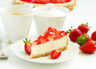 Wall Mural - Classic cheesecake with fresh strawberries. Selective focus.