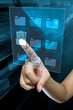 Leinwandbild Motiv a woman hand is searching data in a folder on a digital screen