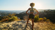 © Joshua Resnick - fit african american woman hiking runyon canyon stopping to see view of sunset