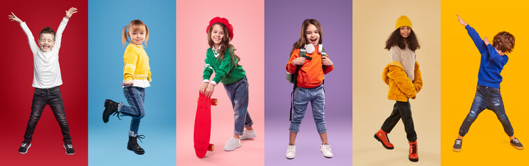 Cheerful multiracial little girls and boys against vibrant background