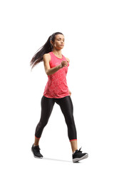 Wall Mural - Young woman in sportswear training fast walking