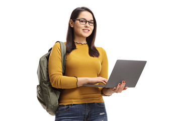 Wall Mural - Smiling female student with a laptop computer